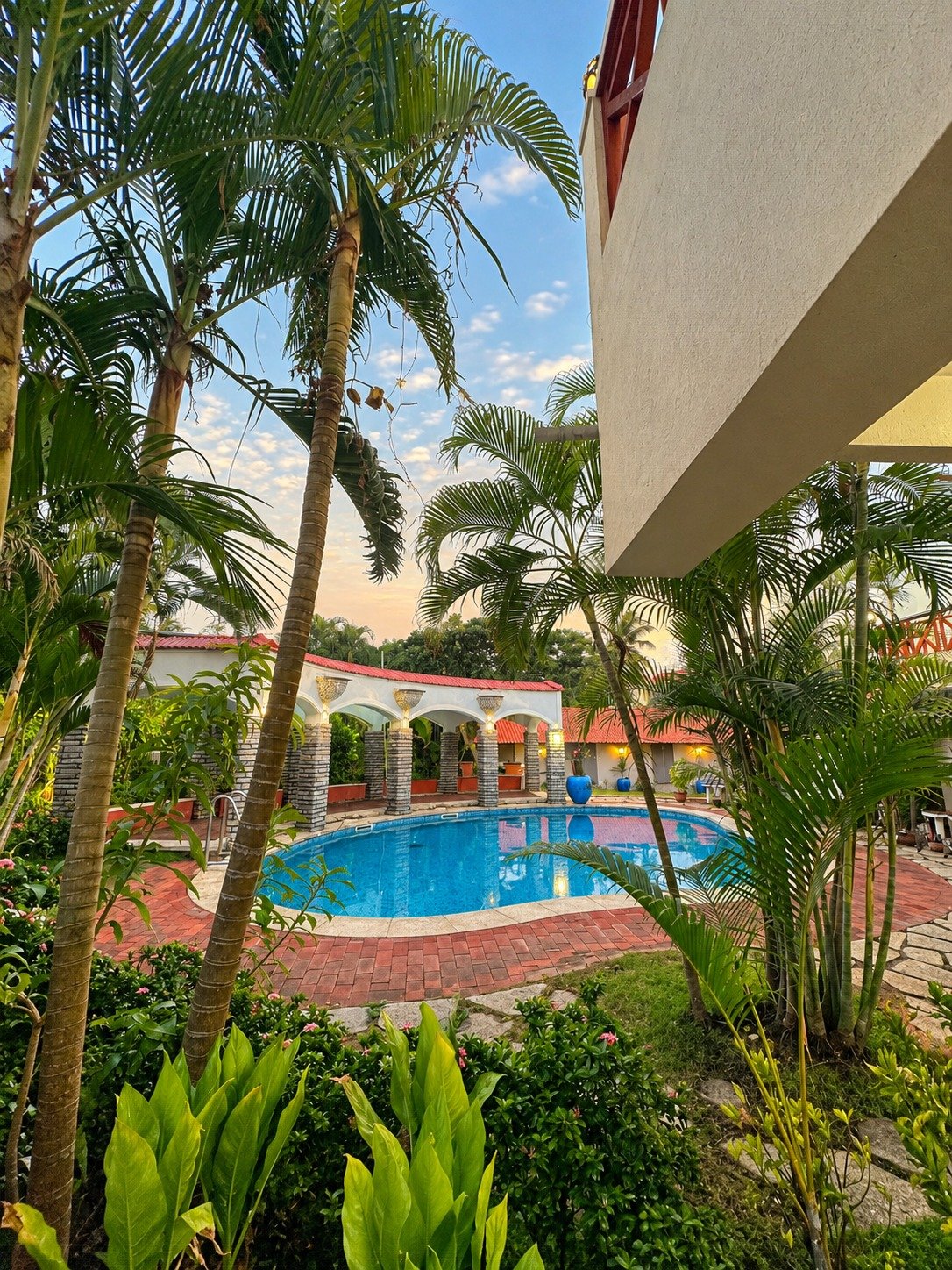 The Pavilion resort exterior surrounded by tropical greenery